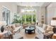 Lobby with comfortable seating areas, large windows, and trees outside at 155 Wingo Way # 421, Mount Pleasant, SC 29464