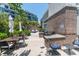 Outdoor grilling area with multiple grills, prep areas, dining tables, and a fire pit at 155 Wingo Way # 421, Mount Pleasant, SC 29464