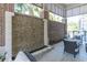 Relaxing outdoor patio featuring stylish seating, a water feature, and lush greenery at 155 Wingo Way # 421, Mount Pleasant, SC 29464