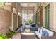 Charming outdoor patio with cozy seating, brick accents, and serene ambiance at 155 Wingo Way # 421, Mount Pleasant, SC 29464