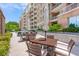 Outdoor seating area with tables and chairs offer residents an outdoor oasis for relaxation at 155 Wingo Way # 421, Mount Pleasant, SC 29464