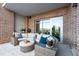 Relax on this patio with brick accents, plush seating, and beautiful views at 155 Wingo Way # 421, Mount Pleasant, SC 29464
