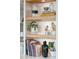 Stylish shelving displaying books and decor, complemented by modern lighting fixtures at 155 Wingo Way # 421, Mount Pleasant, SC 29464