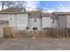Rear view of the home with a fenced-in yard and grey siding at 1662 Hunters Run Dr, Mount Pleasant, SC 29464