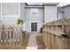 Exterior view of the home's rear featuring a fenced backyard and sliding glass doors at 1662 Hunters Run Dr, Mount Pleasant, SC 29464