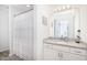 Bright bathroom featuring a large mirror, granite counters, and shower at 1662 Hunters Run Dr, Mount Pleasant, SC 29464