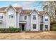 Charming gray townhouse with an inviting front entrance and well-maintained landscaping at 1662 Hunters Run Dr, Mount Pleasant, SC 29464