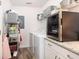 Well-organized laundry room with granite counters, wine cooler, washer, and wire shelving at 1662 Hunters Run Dr, Mount Pleasant, SC 29464