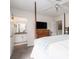 Primary bedroom featuring four-poster bed and ensuite bathroom at 1662 Hunters Run Dr, Mount Pleasant, SC 29464
