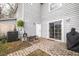 Back patio with brick flooring, a grill, and access to the home's entrance at 1662 Hunters Run Dr, Mount Pleasant, SC 29464