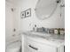 Bathroom showcasing a marble countertop vanity, elegant fixtures, and a shower-tub combo at 167 Spring St # A/B, Charleston, SC 29403