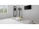 A cozy bedroom featuring a queen bed, large window, and mounted television at 167 Spring St # A/B, Charleston, SC 29403