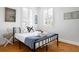 Cozy bedroom with natural light, hardwood floors, and stylish decor at 167 Spring St # A/B, Charleston, SC 29403