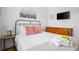 A cozy bedroom featuring a queen bed, dresser, and ample natural light at 167 Spring St # A/B, Charleston, SC 29403