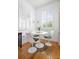 Bright dining area featuring hardwood floors, a round table with four chairs, and natural light at 167 Spring St # A/B, Charleston, SC 29403