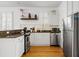 A compact, efficient kitchen featuring stainless steel appliances and marble tile backsplash at 167 Spring St # A/B, Charleston, SC 29403
