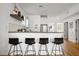 A compact, efficient kitchen featuring stainless steel appliances and bar stool seating at 167 Spring St # A/B, Charleston, SC 29403