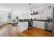 An open concept kitchen featuring stainless steel appliances, island and open to the living area at 167 Spring St # A/B, Charleston, SC 29403