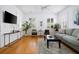 Well-lit living room featuring hardwood floors, comfortable seating and decor at 167 Spring St # A/B, Charleston, SC 29403