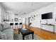 Open-concept living area with a view of the kitchen and ample natural light at 167 Spring St # A/B, Charleston, SC 29403
