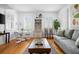 Cozy living room featuring hardwood floors, a comfortable couch, and natural light at 167 Spring St # A/B, Charleston, SC 29403