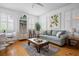 Cozy living room featuring hardwood floors, a comfortable couch, and natural light at 167 Spring St # A/B, Charleston, SC 29403