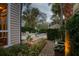Lush backyard featuring a private pool, brick pathway, and a serene lounge area at 18 Logan St, Charleston, SC 29401