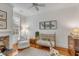 Bright Bedroom featuring hardwood floors, neutral paint, fireplace, and a cozy, comfy vibe at 18 Logan St, Charleston, SC 29401