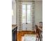 Elegant dining room with French doors and hardwood flooring at 18 Logan St, Charleston, SC 29401