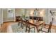 Elegant dining room with fireplace, hardwood floors, and stylish décor at 18 Logan St, Charleston, SC 29401