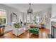Elegant living room with hardwood floors, bay windows, and stylish furniture at 18 Logan St, Charleston, SC 29401