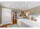 Comfortable bedroom with tray ceiling, white linens, and decorative pillows at 18 Logan St, Charleston, SC 29401