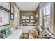 Cozy home office with custom built-ins, a desk, natural light, and displayed diplomas and certifications at 18 Logan St, Charleston, SC 29401