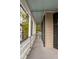 Charming porch with classic columns and black shutters, offering a relaxing outdoor space at 18 Logan St, Charleston, SC 29401