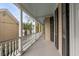 Picturesque porch with white columns, black shutters, and a serene outdoor view at 18 Logan St, Charleston, SC 29401