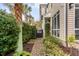 Lush side yard with brick path and well-maintained greenery at 18 Logan St, Charleston, SC 29401