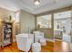 Comfortable sitting room with reading nook, hardwood floors, and natural light at 18 Logan St, Charleston, SC 29401