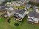 Aerial view of the backyard with patio, green space, and screened porch at 213 Palmetto Walk Dr, Summerville, SC 29486