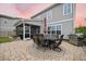 Charming backyard patio featuring an outdoor dining set, grill, and screened-in porch for seamless indoor-outdoor living at 213 Palmetto Walk Dr, Summerville, SC 29486
