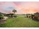 Expansive lawn leading to serene pond views; ideal for peaceful outdoor enjoyment at 213 Palmetto Walk Dr, Summerville, SC 29486