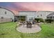 Landscaped backyard featuring a charming paver patio perfect for outdoor gatherings at 213 Palmetto Walk Dr, Summerville, SC 29486