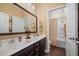 Bathroom featuring double sinks, dark wood cabinets, and a separate toilet and shower area at 213 Palmetto Walk Dr, Summerville, SC 29486