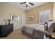 Cozy bedroom with neutral tones, plush carpeting, and a large window for natural light at 213 Palmetto Walk Dr, Summerville, SC 29486