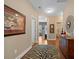 Spacious hallway with hardwood floors, neutral paint, decorative rug, and stylish accent pieces at 213 Palmetto Walk Dr, Summerville, SC 29486