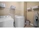 Laundry room with washer, dryer, wire shelving, and space for organizing household items at 213 Palmetto Walk Dr, Summerville, SC 29486