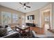 Inviting living room with neutral walls, dark wood floors, comfortable seating, and ample natural light at 213 Palmetto Walk Dr, Summerville, SC 29486