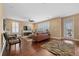 Bright and airy living room showcasing hardwood floors and stylish furnishings at 213 Palmetto Walk Dr, Summerville, SC 29486