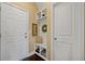 Well-organized mudroom with storage bench, coat hooks, and shelving for shoes and accessories at 213 Palmetto Walk Dr, Summerville, SC 29486