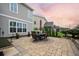 Outdoor patio featuring brick pavers, comfortable seating, and views of the well-maintained backyard at 213 Palmetto Walk Dr, Summerville, SC 29486