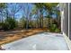 Backyard featuring a cement patio with a view of the expansive yard and the surrounding trees at 2176 Andover Way, Mount Pleasant, SC 29466